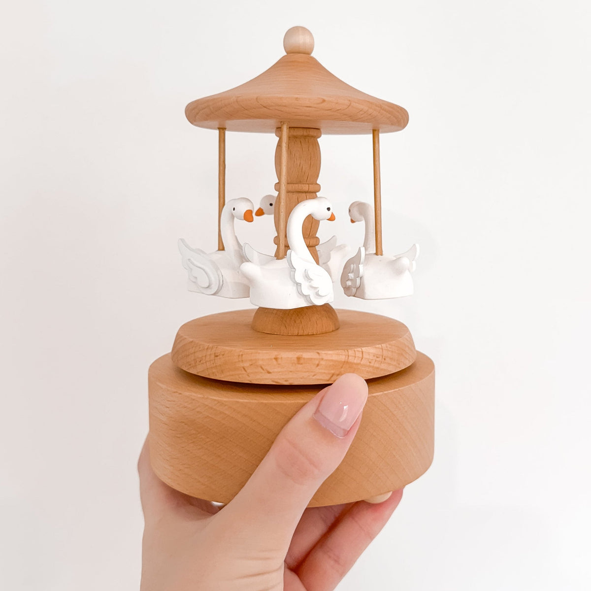 Heirloom wooden musical carousel with swan figures