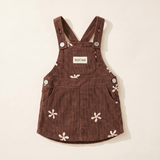 Flower corduroy baby pinafore dress in cocoa with cream and pink embroidered flowers, folded flat