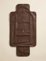 The Everyday Change Mat unfolded, chocolate pebbled vegan leather exterior