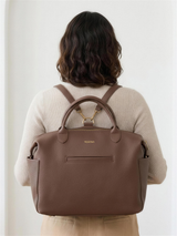 Wyld Bub Everyday Baby Bag worn as a backpack using the convertible strap and gold D-rings