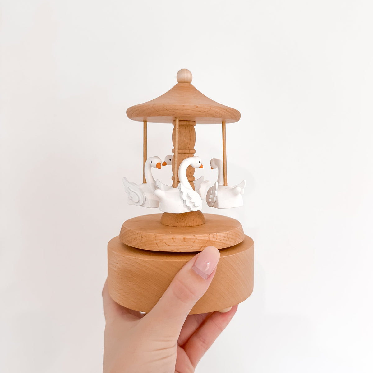 Heirloom wooden musical carousel with swan figures