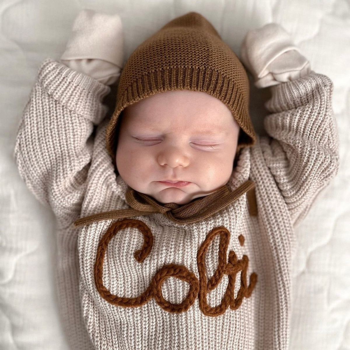 Hand knitted personalized baby sweater with custom embroidered name by Wyld Bub