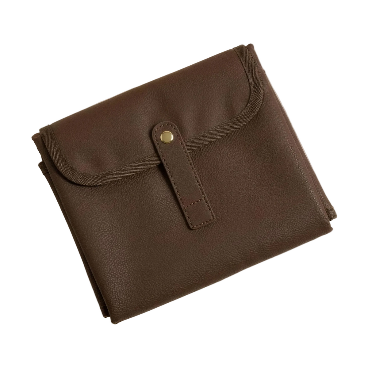 The Everyday Change Mat folded, chocolate pebbled vegan leather with gold snap