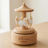 Personalised wooden sheep carousel engraved with a child's name on the beech base