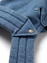 Close-up of quilted hood band and gold snap button detail