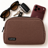 Wyld Bub cacao linen pouch styled with a burgundy phone, keys and sunglasses