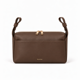The Everyday Stroller Bag in chocolate brown vegan leather, front view with upright stroller straps on white