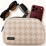 Wyld Bub Oatmeal Houndstooth pouch styled with burgundy phone, keys and sunglasses