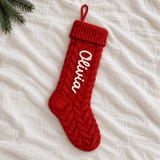 Red cable-knit personalised Christmas stocking with Olivia in ivory yarn