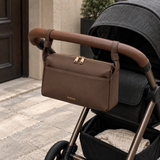 Chocolate brown Wyld Bub Everyday Stroller Bag attached to a charcoal pram